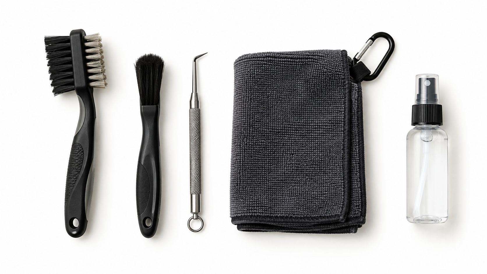 A professional golf club cleaning kit arranged neatly on a plain white background for maintenance.
