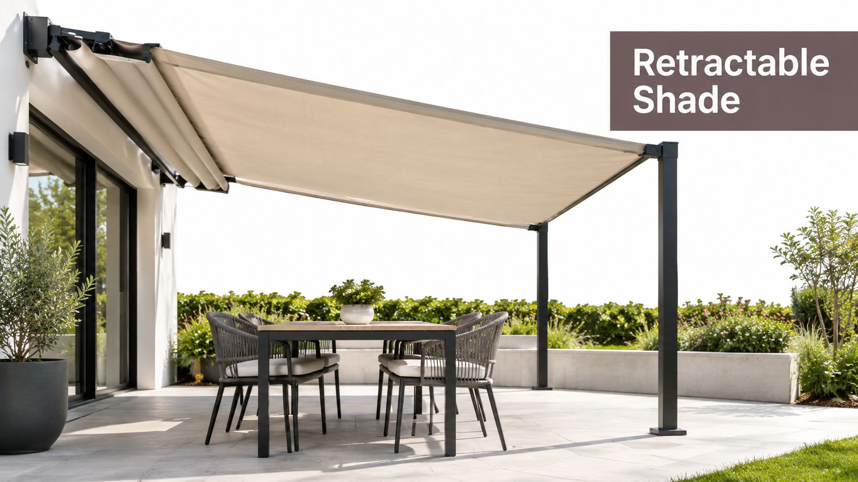 A modern outdoor patio set under a stylish beige retractable shade cover on a sunny terrace.