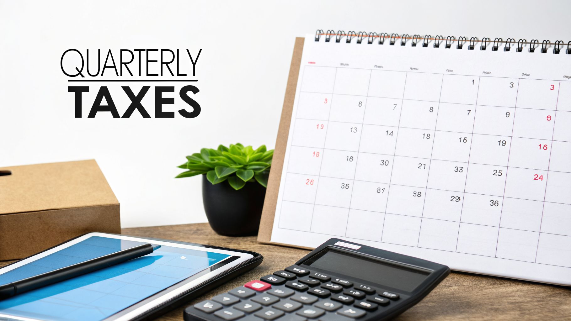 A desk with a calendar, calculator, tablet, and text "QUARTERLY TAXES" on a white background.