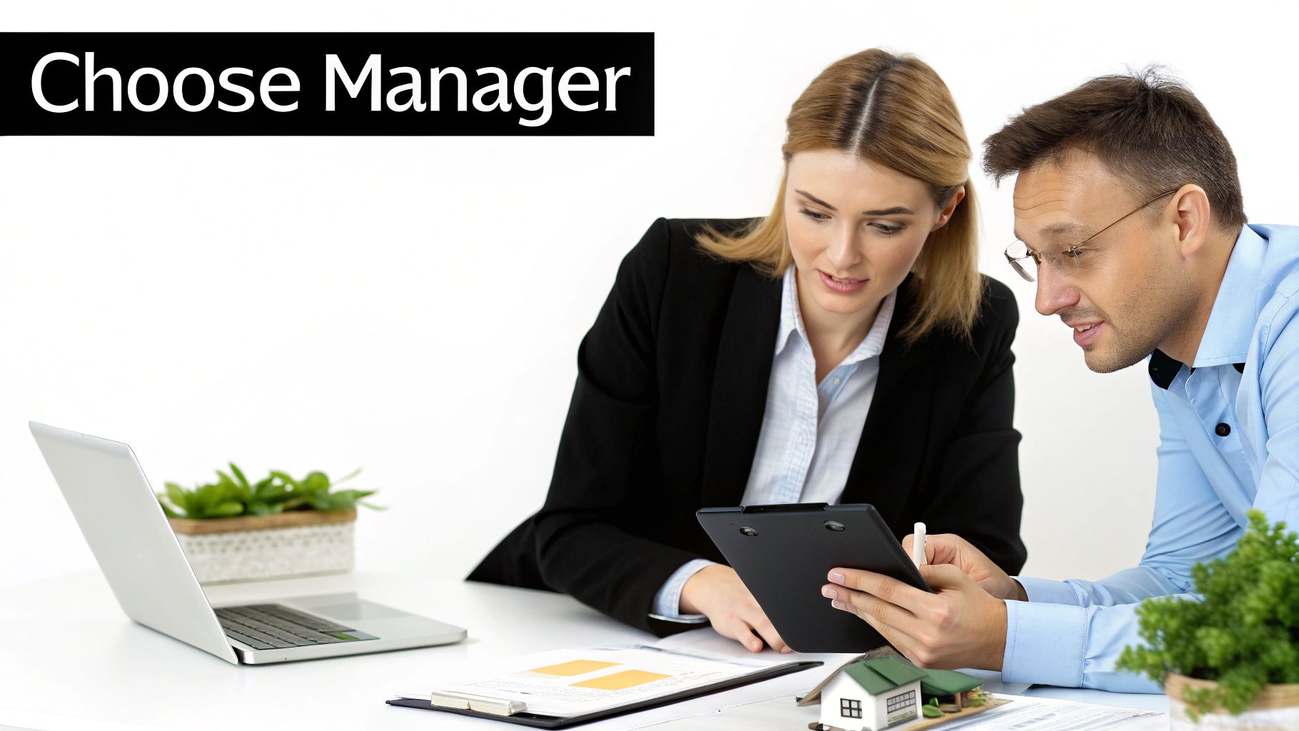 Two property managers discuss documents and a miniature house model during a business meeting.