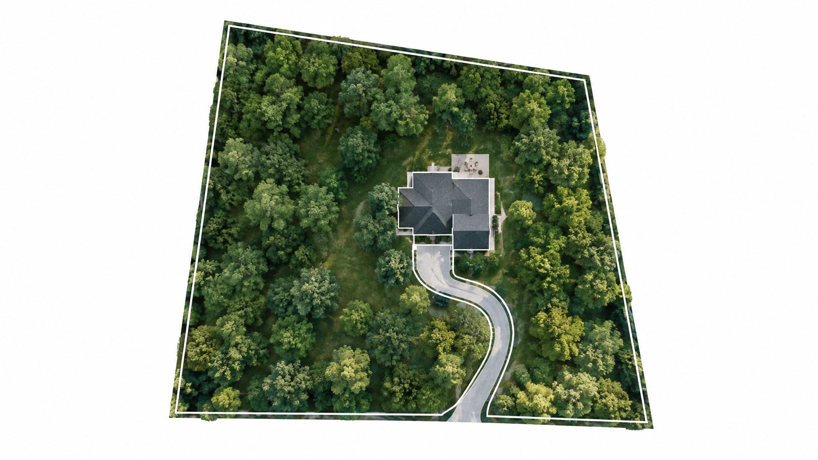An aerial view of a single-family house nestled within a dense, lush green wooded residential property lot.