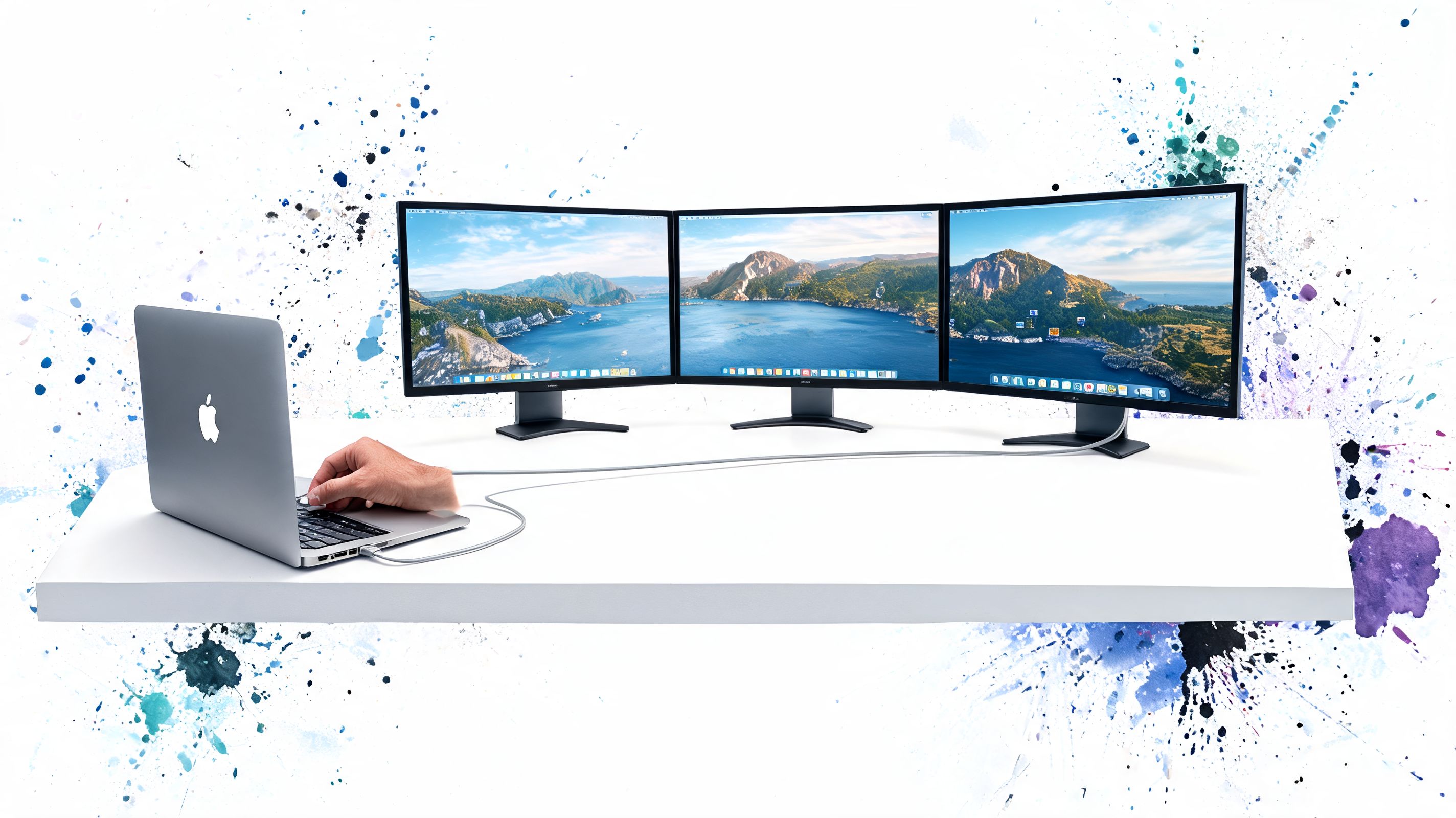 A silver MacBook Pro laptop connected to three external monitors displayed on a clean white desk surface.
