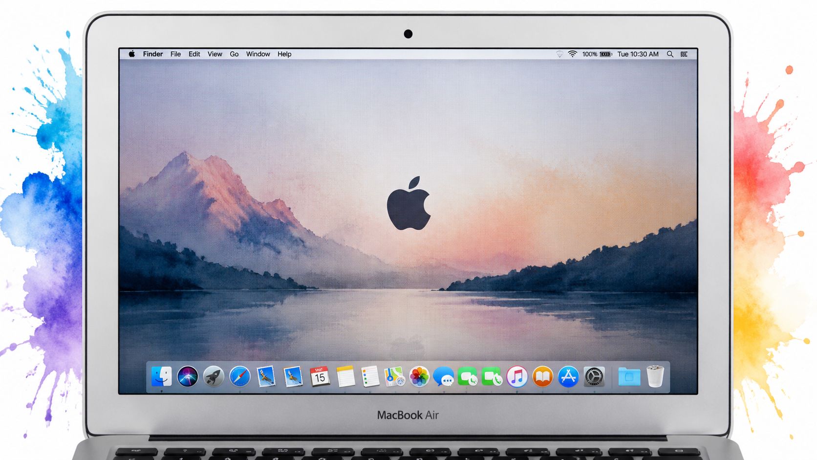 A silver MacBook Air displaying a calm mountain landscape wallpaper on its desktop screen.