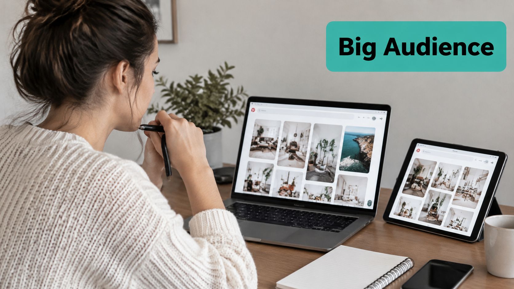 A woman working on her laptop and tablet while browsing Pinterest for creative design inspiration ideas.
