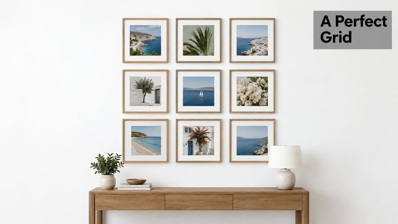 A gallery wall arrangement of nine square framed coastal photos hanging above a wooden console table.