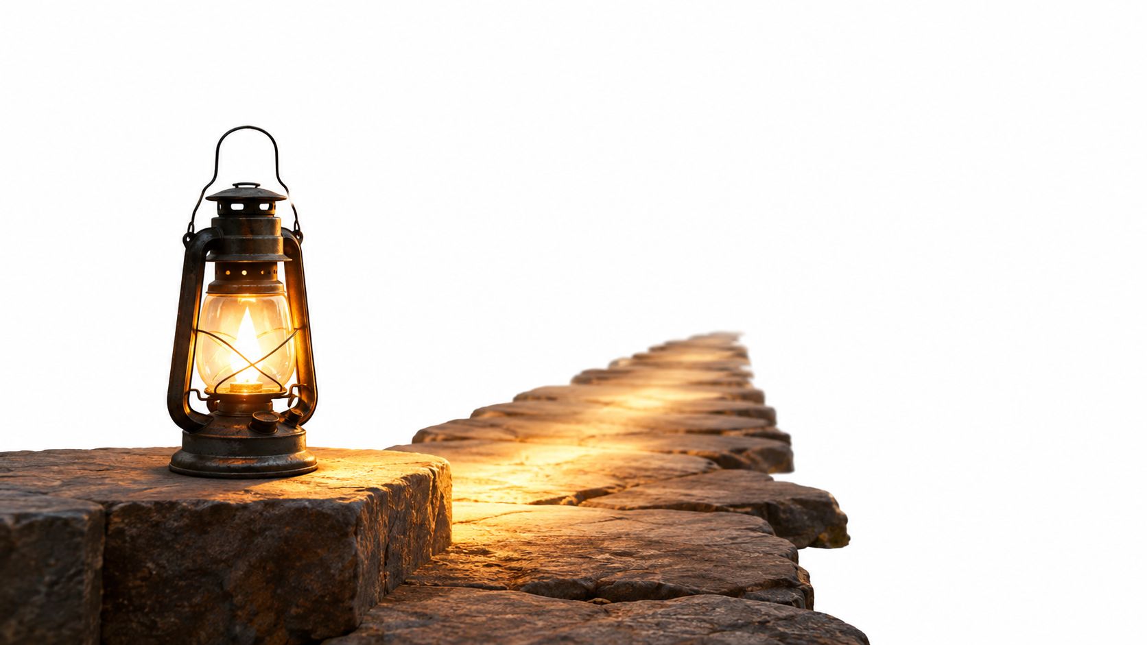 A vintage metal lantern illuminating a rustic stone path leading into a bright white background.