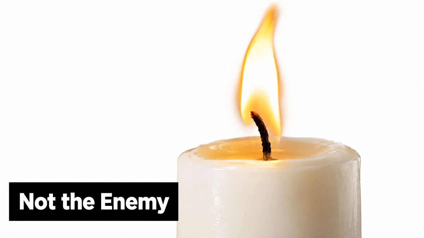 A close-up image of a lit white candle flame isolated against a pure white background.