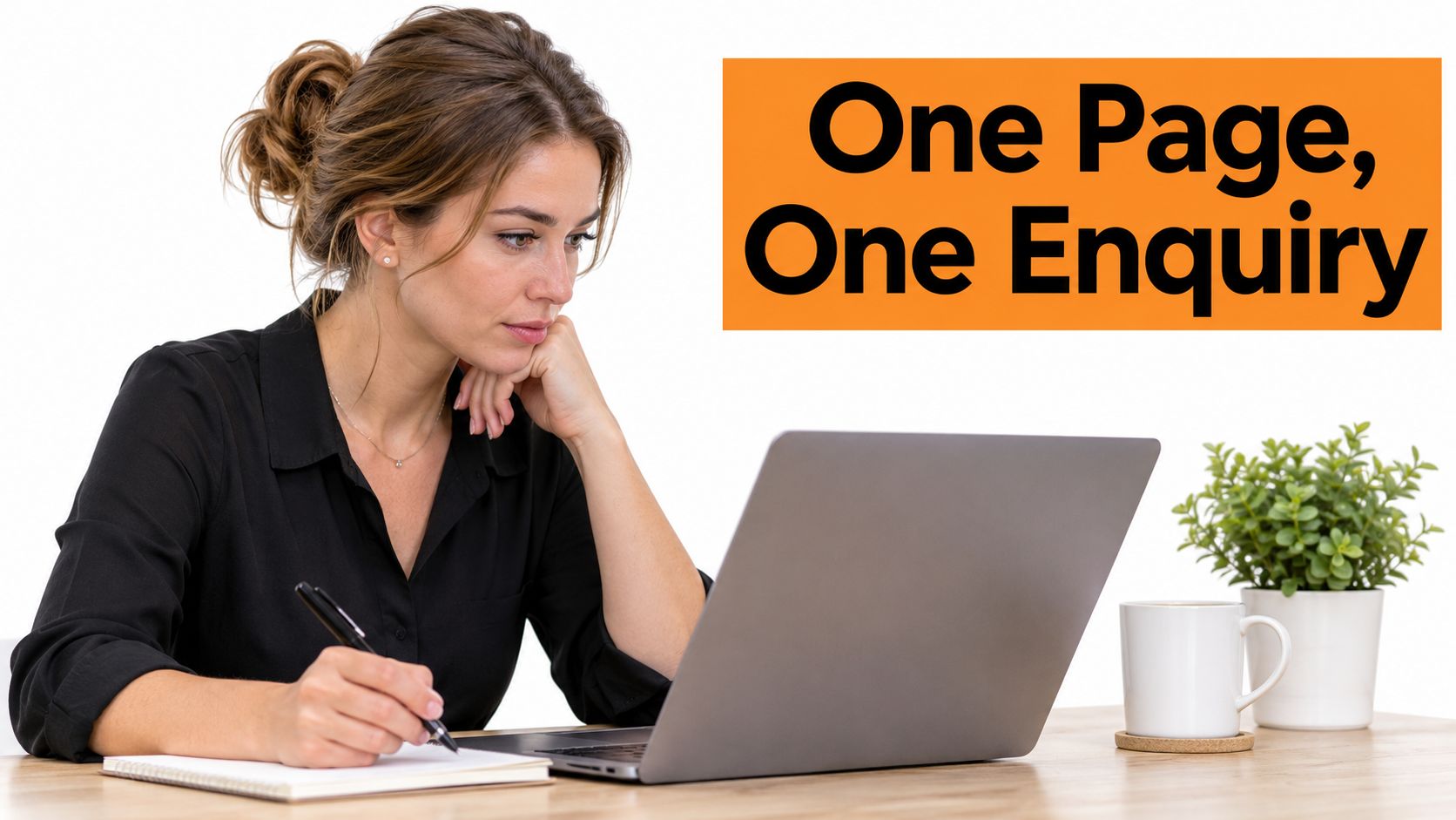 A professional woman sitting at a desk, looking at her laptop while taking notes on a notepad.