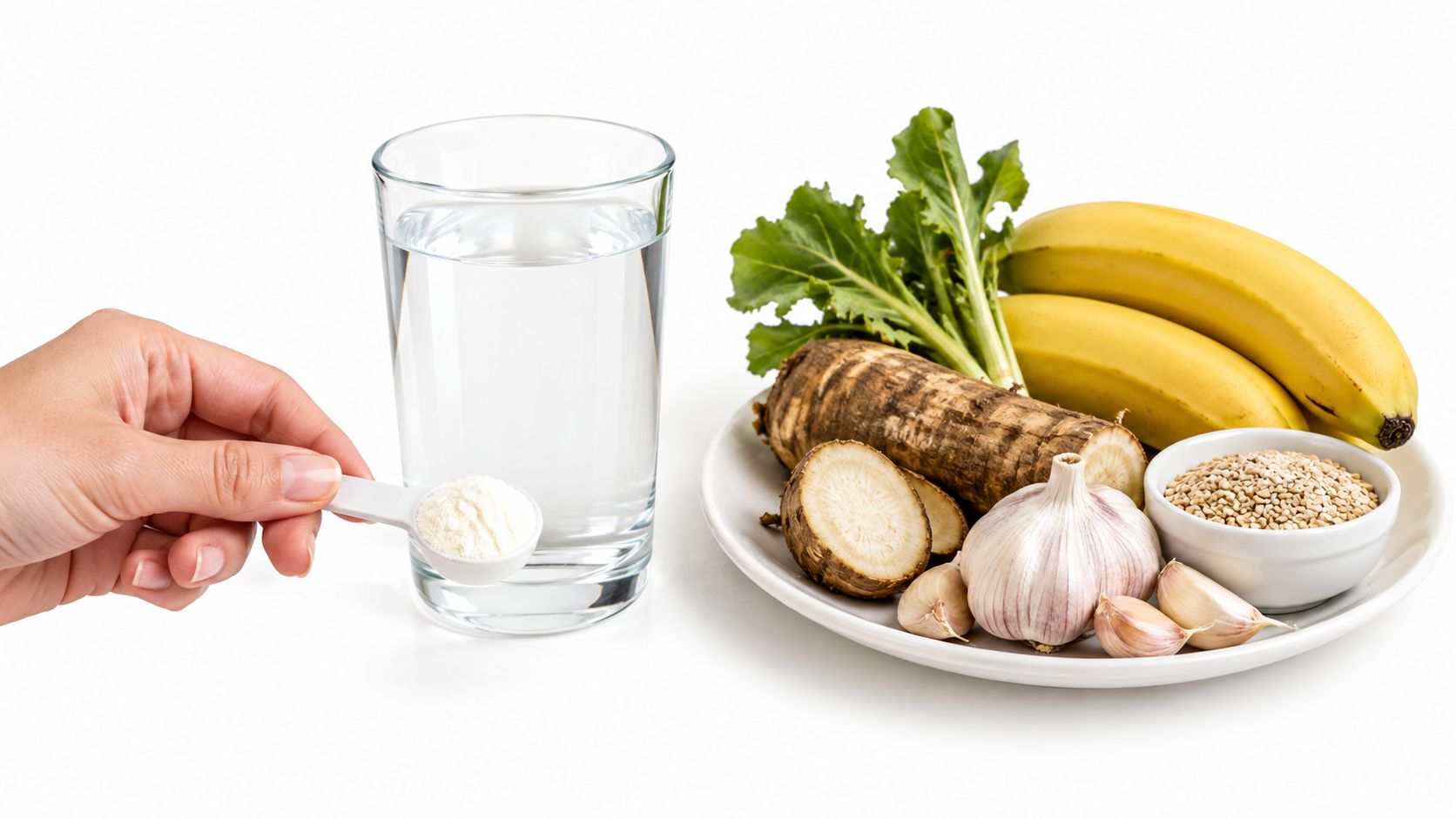 A hand holding a scoop of prebiotic powder next to a glass of water and healthy ingredients.