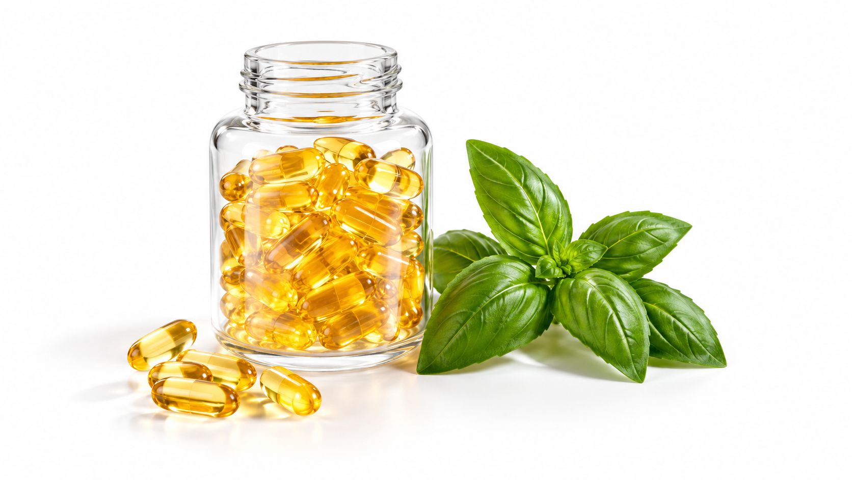 A glass bottle filled with yellow supplement capsules next to fresh green basil leaves on white background.