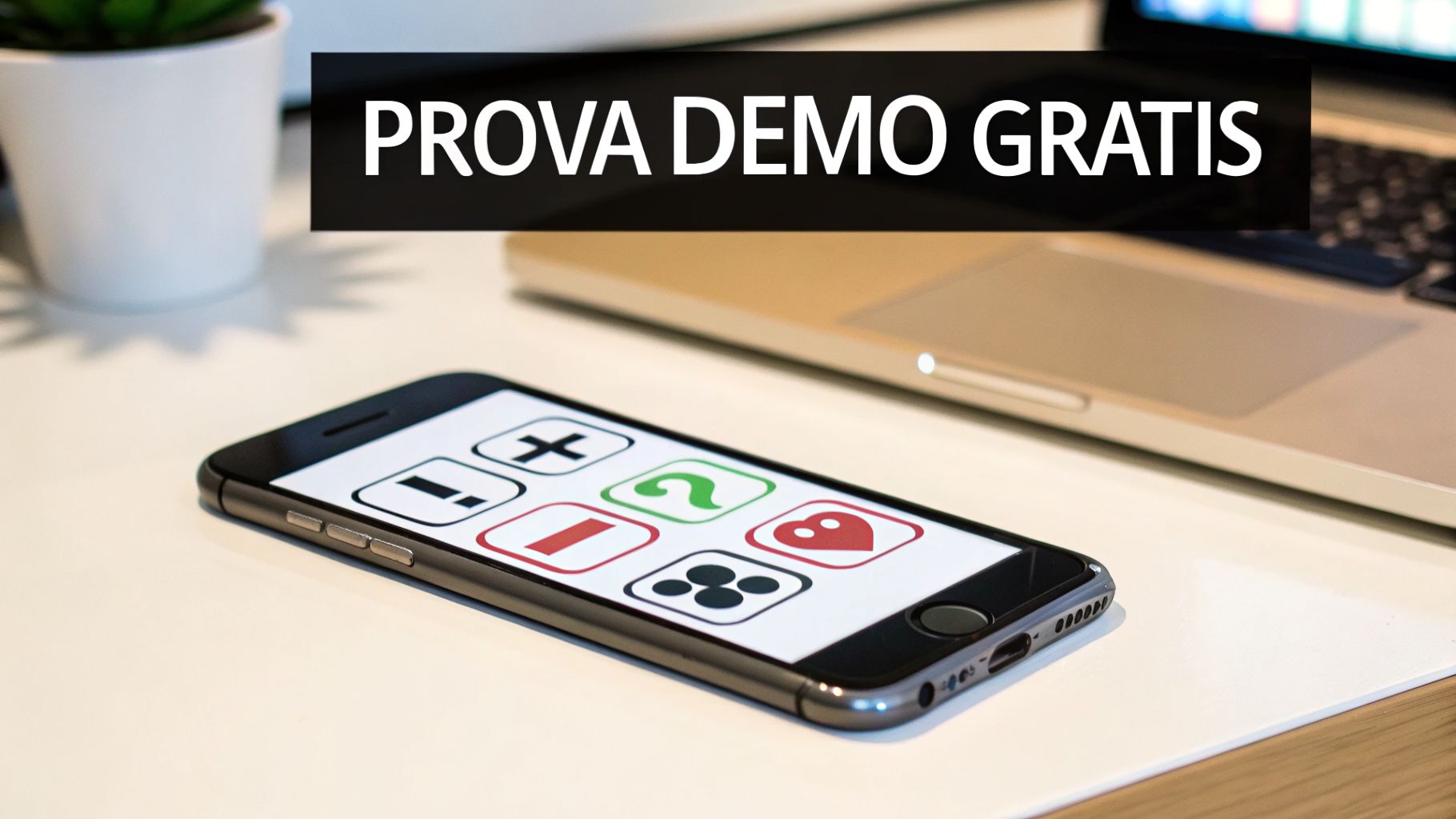 Uno smartphone su una scrivania bianca con la scritta 'PROVA DEMO GRATIS' e icone di app, con un laptop e una pianta sullo sfondo.