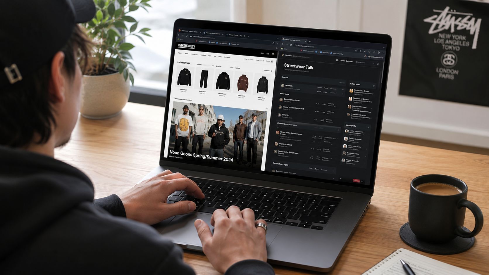 A person browsing online streetwear brand websites on a laptop while sitting at a wooden desk.