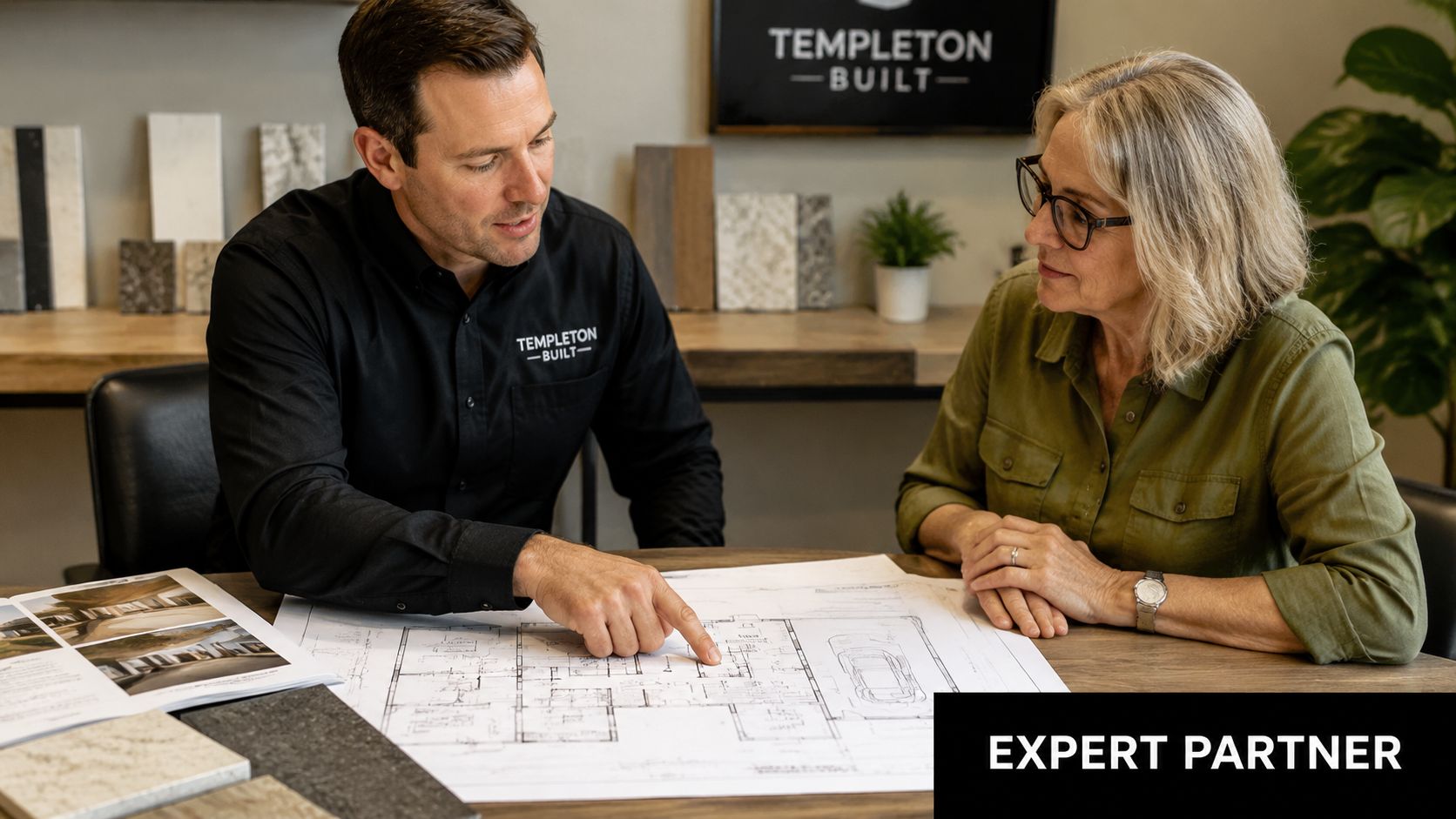 A professional builder discussing architectural floor plans with a client in a modern design studio.